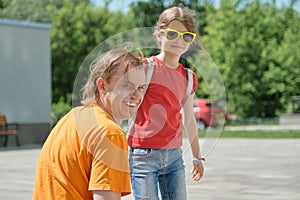 Outdoor summer portrait of father and daughter, happy smiling dad with child