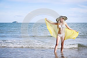 Outdoor summer portrait of the front image of beautiful girls in a sexy bikini standing on the beach in summer. sexy body. concept