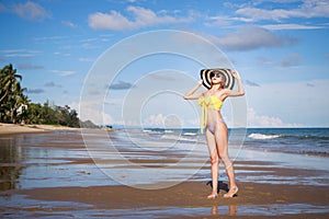Outdoor summer portrait of the front image of beautiful girls in a sexy bikini standing on the beach in summer. sexy body. concept