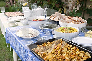 Outdoor summer wedding party event catering banquet with food and elegant table setting