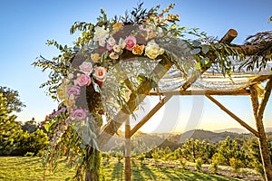 Jewish traditions wedding ceremony. Wedding canopy chuppah or huppah close up on the flowers