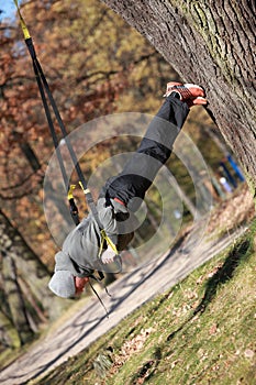 Outdoor suspension training in forest