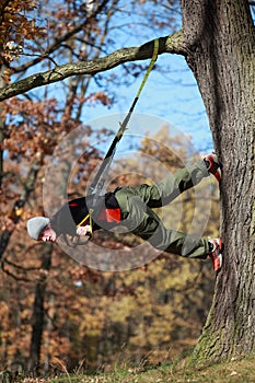 Outdoor suspension training in forest