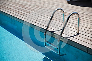 Outdoor swimming pool ladder