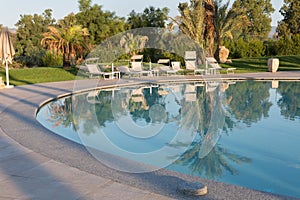 Outdoor Swimming Pool, Palm Trees and White Beach Loungers