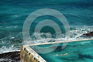 Outdoor swimming pool by sea