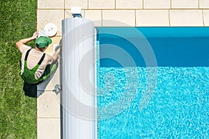 Outdoor Swimming Pool Skimmer Filter Cleaning Aerial View