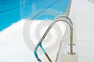 Outdoor swimming pool with stair in a building