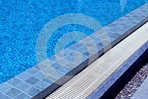 Outdoor swimming pool steps with clear water surface background, nobody, underwater pattern blue background with grid tiles,