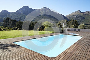 Outdoor Swimming Pool Surrounded With Wooden Decking