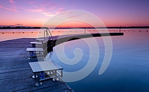 Outdoor swinnging pool and Jetty in Zeewolde during sunruse