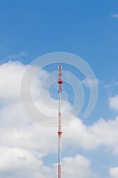 Outdoor tele communication red and white tower blue sky and cloud