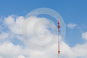 Outdoor tele communication red and white tower blue sky and cloud