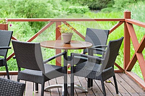 Outdoor terrace cafe table with three chairs