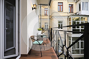 Outdoor terrace with table and chairs in the apartment