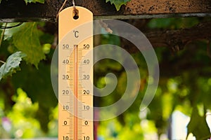 Outdoor thermometer reaches 40 forty degrees centigrade. photo