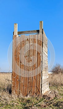 Outdoor toilet made from old wooden planks