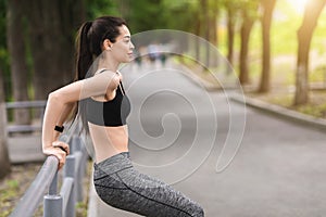 Outdoor Training. Asian Girl Exercising With Handrail In Park, Making Push Ups