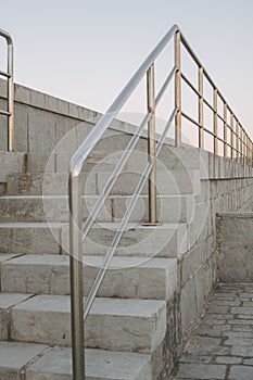 Outdoor urban stairs with metal handrails