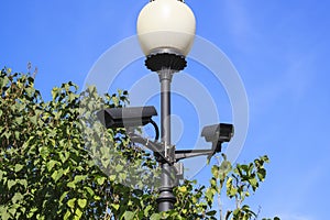 outdoor video surveillance cameras installed in several d photo