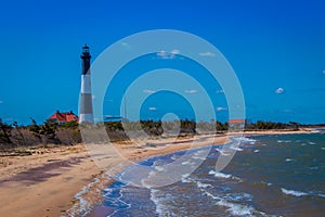 Outdoor view of Atlantic ocean waves on the beach at Montauk Point Light, Lighthouse, located in Long Island, New York