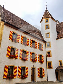 Outdoor View of Colorful Classic Castle Exteriors Walls and Windows in old town Neuchatel, Switzerland, Europe