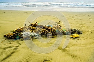 Outdoor view of fishing net and ropes garbage in the beach, every day, waste accumulates on the beach of Atlantic west