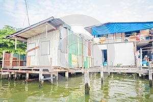 Outdoor view of floating poor house on the Chao Phraya river. Thailand, Bangkok