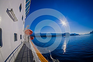 Outdoor view of Hurtigruten cruise, view from deck with a life boat in case an accident