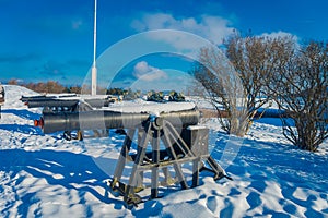 Outdoor view of Kristiansten fortress and cannons over the snow in Trondheim