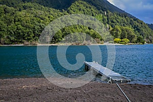 Outdoor view of metallic strcuture in the shore in the lake of todos Los Santos, Region in Chile