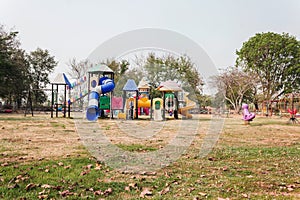 Outdoor village public playground with colourful plaything for