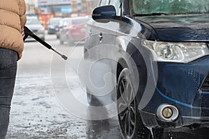Outdoor washing car in winter time