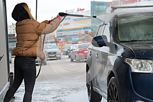 Outdoor washing car in winter time