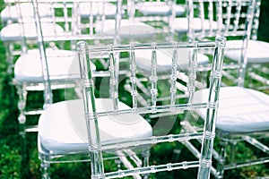 Outdoor wedding ceremony. Reception area with chairs for guests.