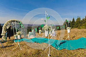 Outdoor wedding ceremony scene on a mountain slope