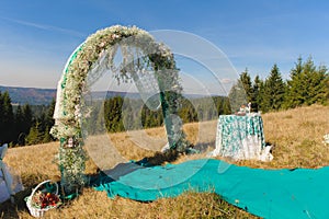 Outdoor wedding ceremony scene on a mountain slope