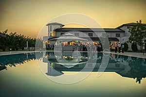 Outdoor wedding reception by the pool