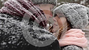 Outdoor winter forest shot of young wedding couple walking and having fun holding hands in snow weather pine forest