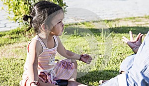 Outdoor yoga class with hand meditating Asian woman meditating in sunset and lens effect flair health care, fitness lifestyle