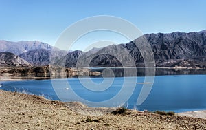 Outdoors awe inspiring nature landscape blue potable water lake with mountains at the background, travel destinations tourism view