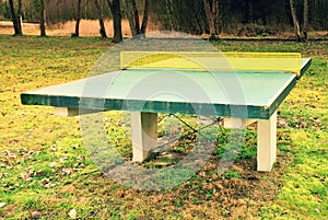 Outdoors green concrete ping pong table in camp