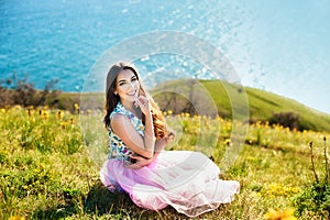 Outdoors portrait of beautiful young brunette girl.