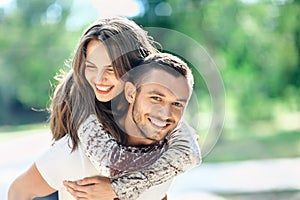 Outdoors portrait of lovers happy young man and woman