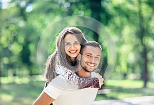 Outdoors portrait of lovers happy young man and woman