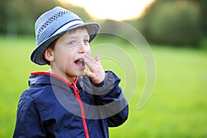 Outdoors portrait of surprised boy