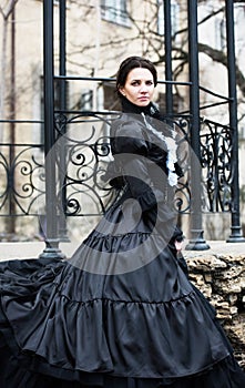 Outdoors portrait of a victorian lady in black