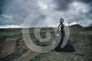 Outdoors portrait of a victorian lady in black