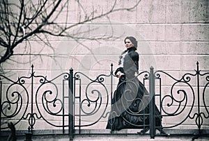 Outdoors portrait of a victorian lady in black