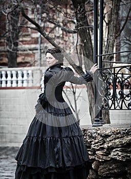 Outdoors portrait of a victorian lady in black